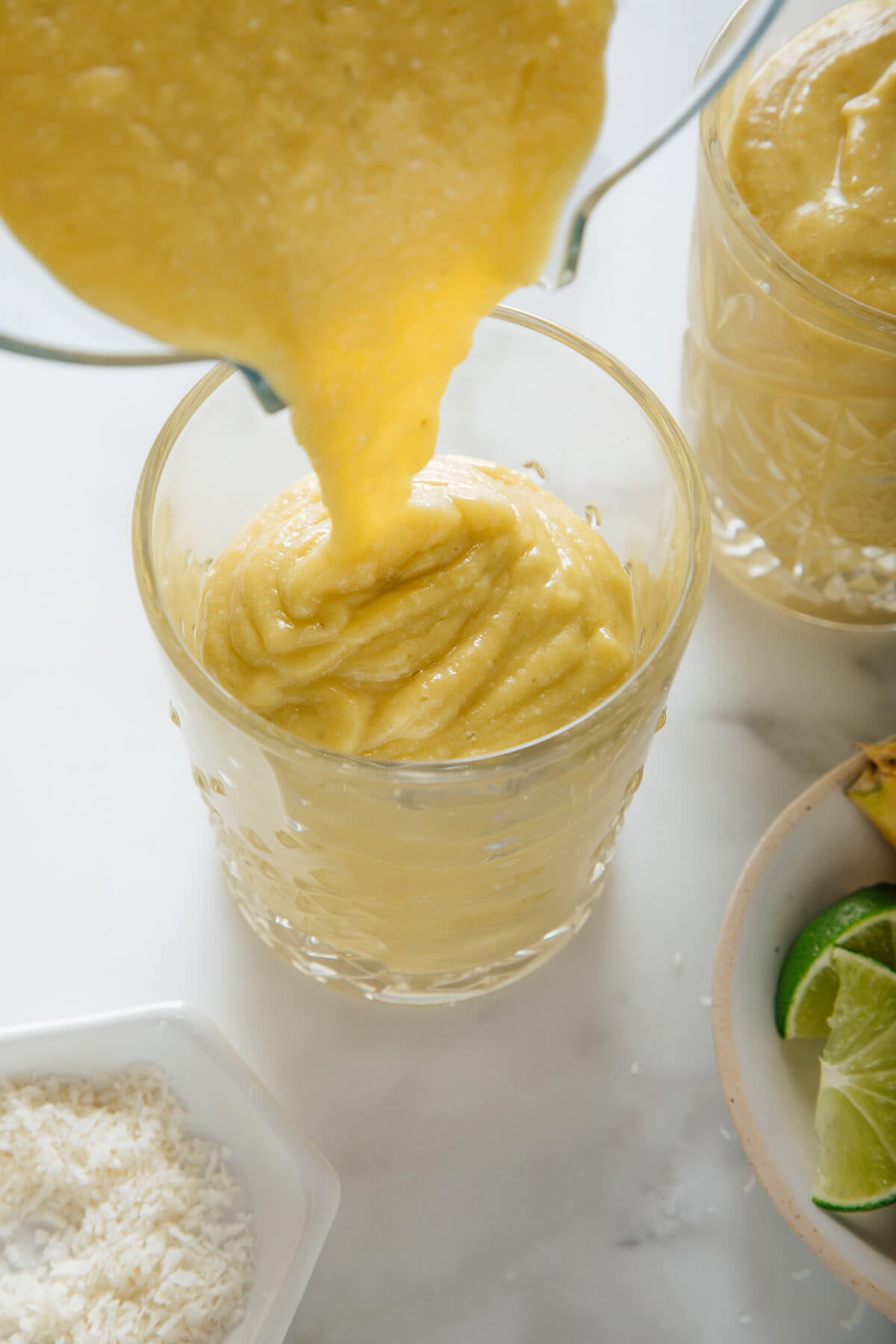 pouring pineapple avocado smoothie