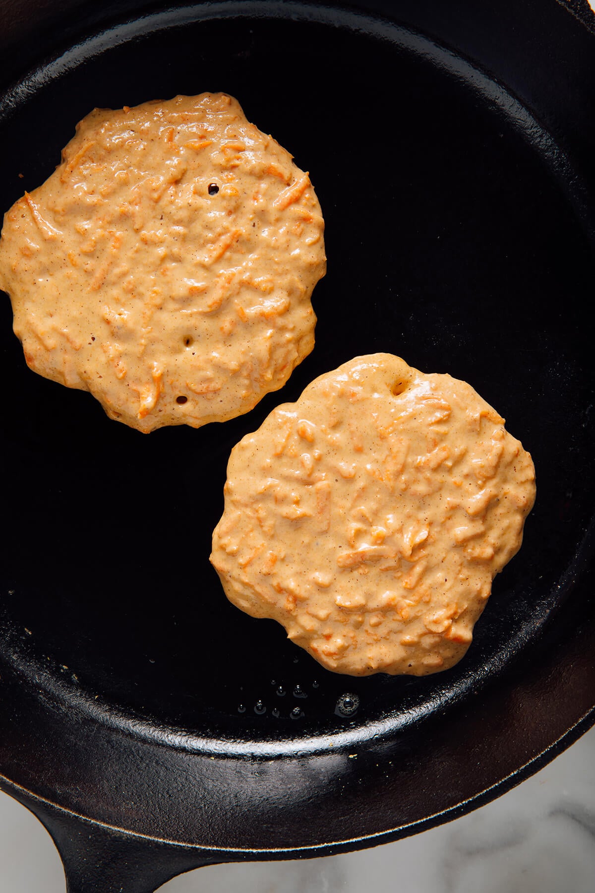 carrot cake pancakes before flipping