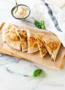 This hummus quesadilla recipe is simple, quick and healthy, too! Dairy-free and vegan (also gluten-free if you use gluten-free tortillas). Get the recipe at cookieandkate.com