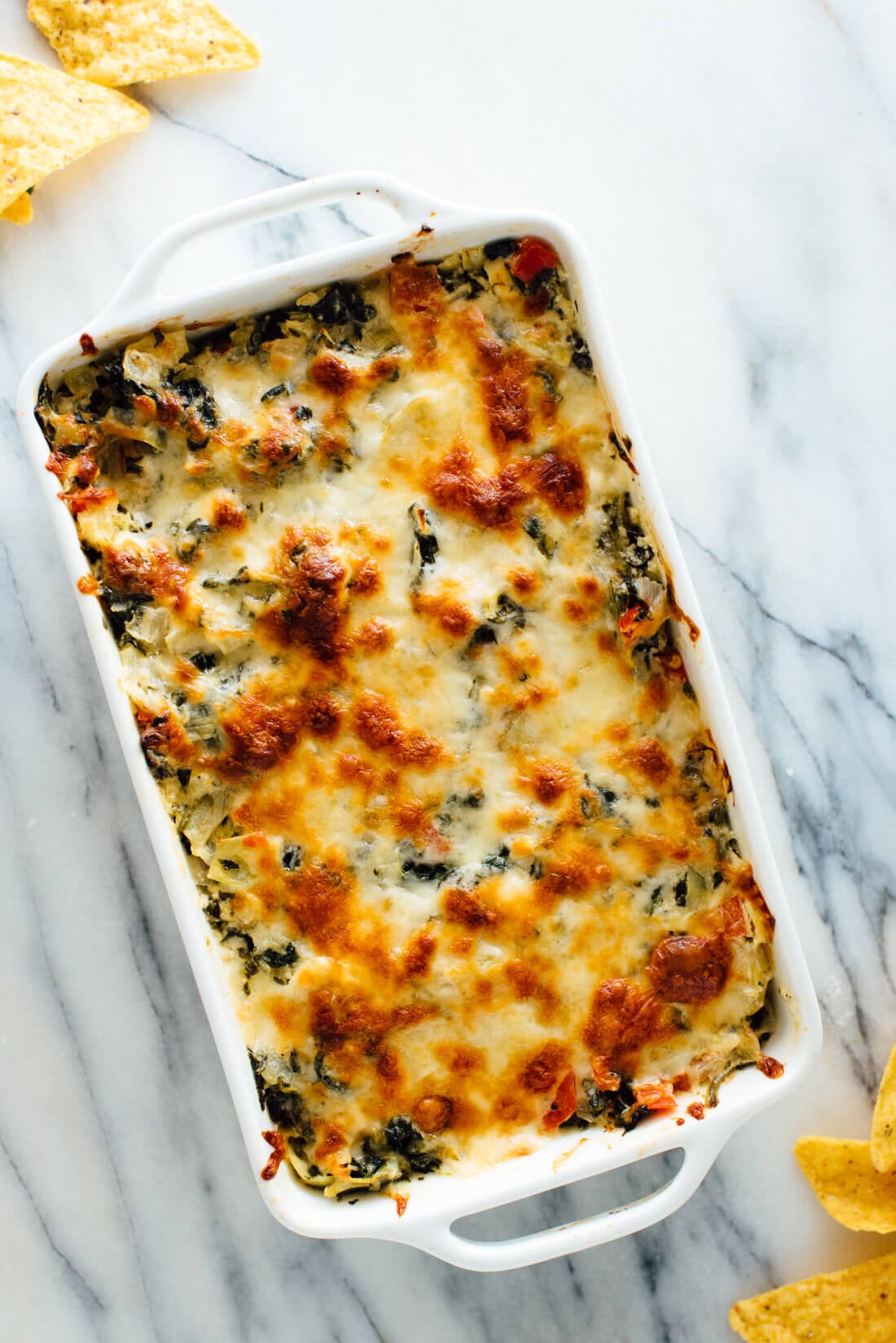 This baked spinach artichoke dip recipe will be a big hit at your next party! It's cheesy but not too heavy. Try and you'll see!
